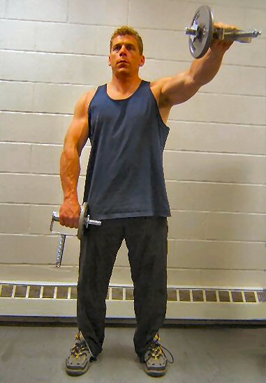 Ray Herbert doing front shoulder raises with the new Heavy Handle Dumbbells. dumbbells, dumbells, dumbell, dumbbell, fitness equipment, bodbbuilding, body building, body-building, firemen games, fireman games, fireman competition, competitor, events, fitness, get in shape, diet, weight loss, 